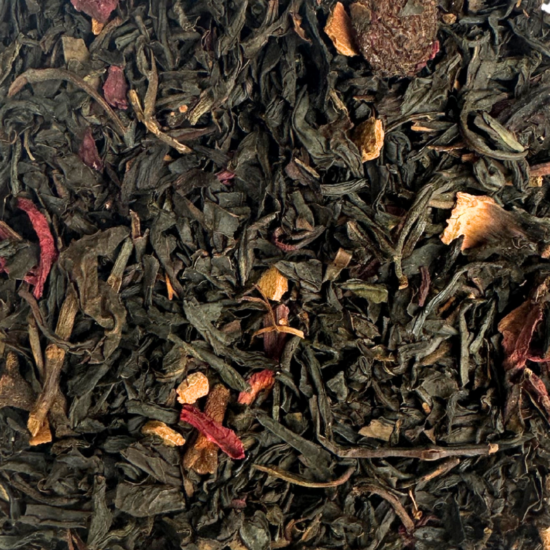 Close-up of Christmas black tea leaves with bits of fruit and spice.