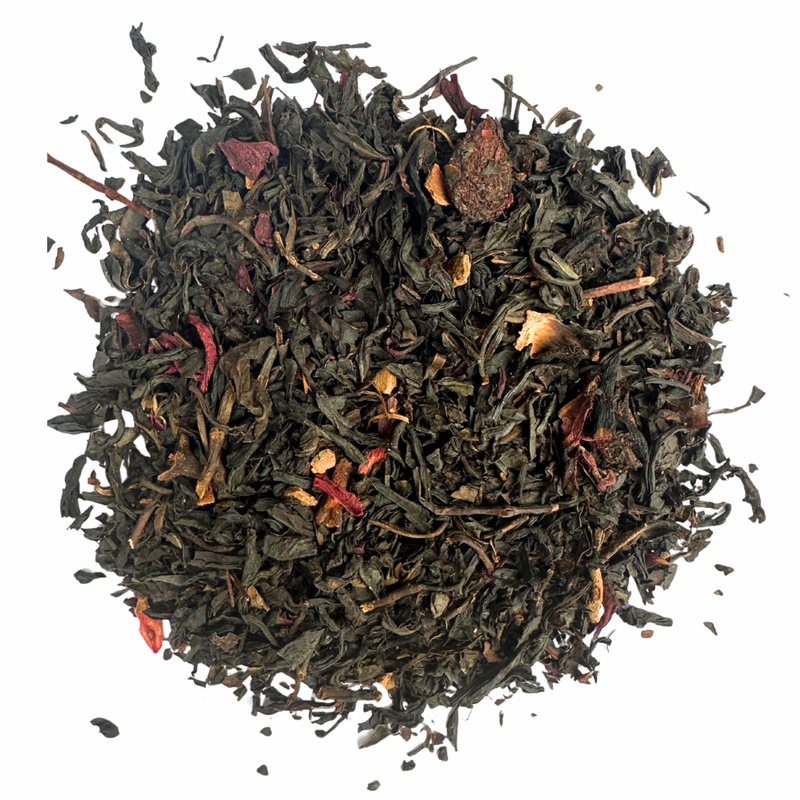 Dry Christmas black tea leaves on a white background.