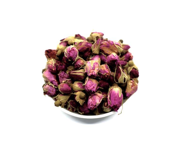 Red rose bud tea in a bowl