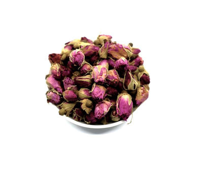 Red rose bud tea in a bowl