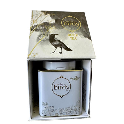 Black tea in tin with a gift box
