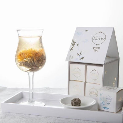 Flowering tea gift box and glass with flowering tea