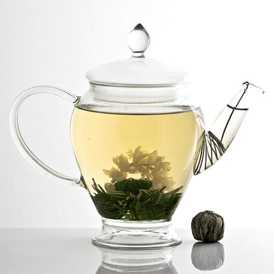 flowering tea - green tea and jasmine in a glass teapot